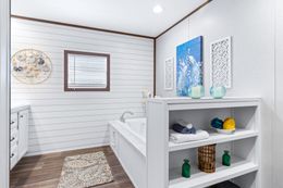 The BREEZE FARMHOUSE 72 Primary Bathroom. This Manufactured Mobile Home features 4 bedrooms and 2 baths.