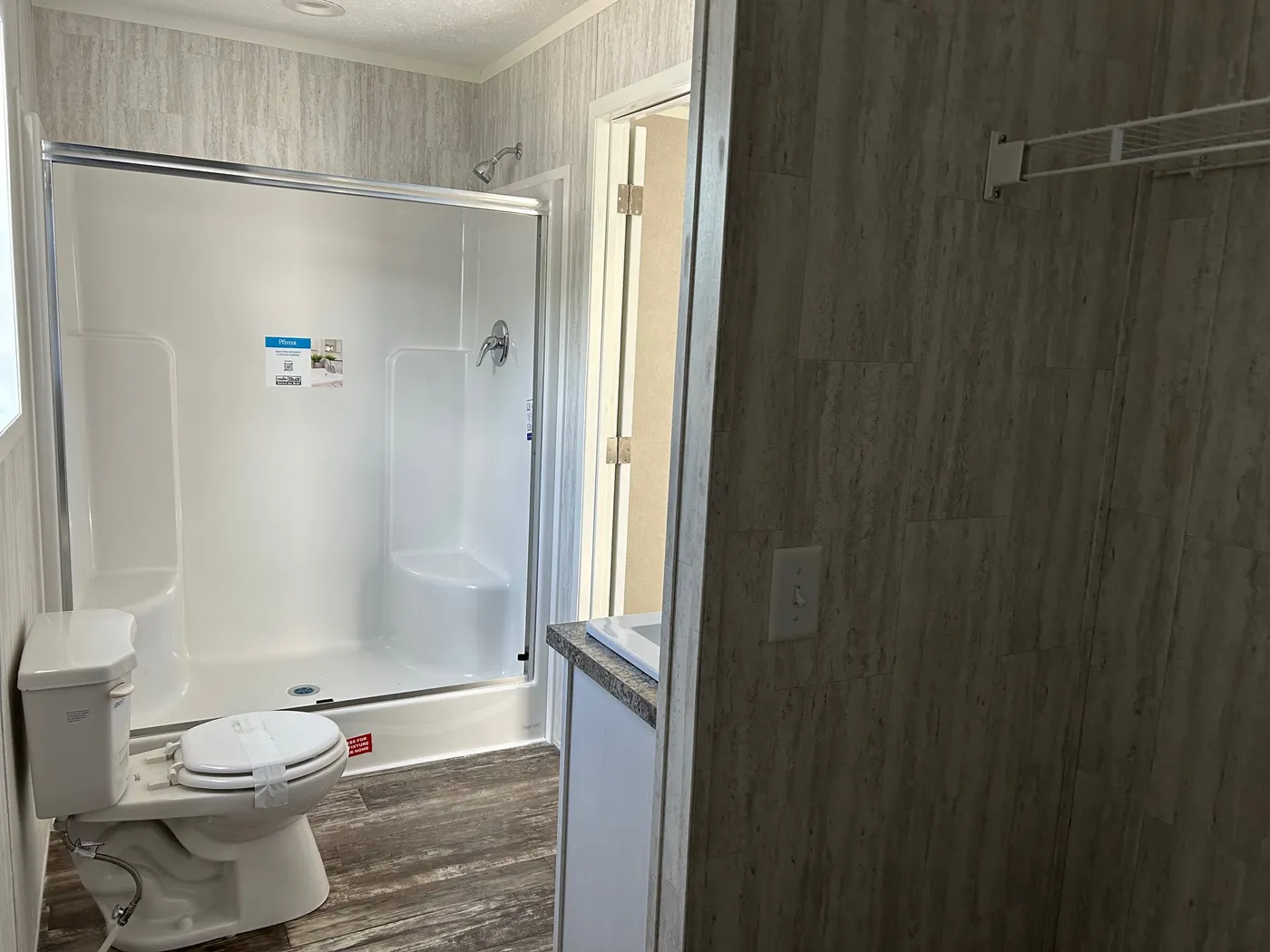 The SAPPHIRE XL 8016-644 Primary Bathroom. This Manufactured Mobile Home features 3 bedrooms and 2 baths.