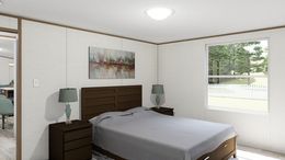 The DELIGHT Primary Bedroom. This Manufactured Mobile Home features 2 bedrooms and 2 baths.