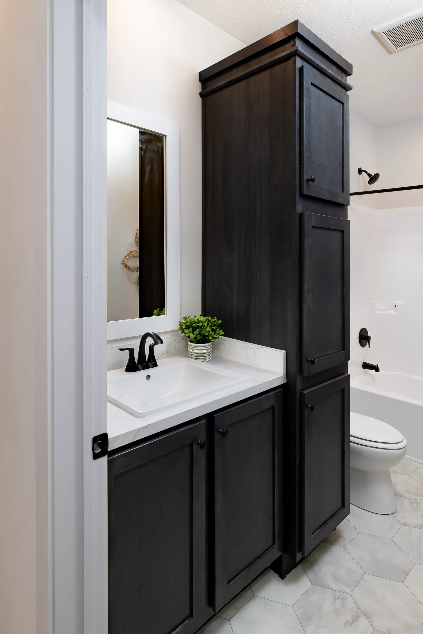 The MCCANN BLVD 6830-MS070 SECT Guest Bathroom. This Manufactured Mobile Home features 3 bedrooms and 2 baths.
