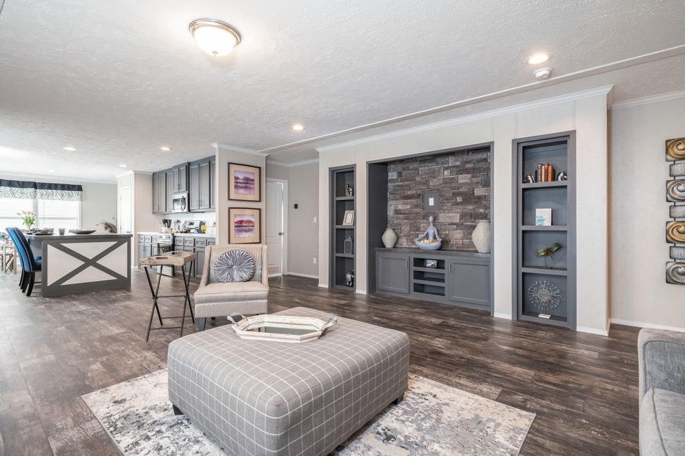 The ALL AMERICAN Living Room. This Manufactured Mobile Home features 3 bedrooms and 2 baths.