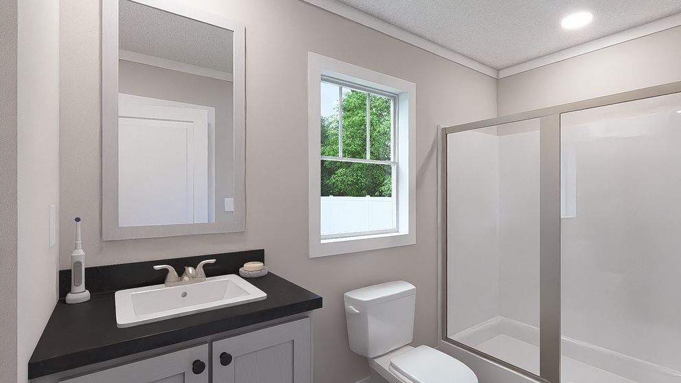 The RHYTHM NATION Primary Bathroom. This Manufactured Mobile Home features 3 bedrooms and 2 baths.