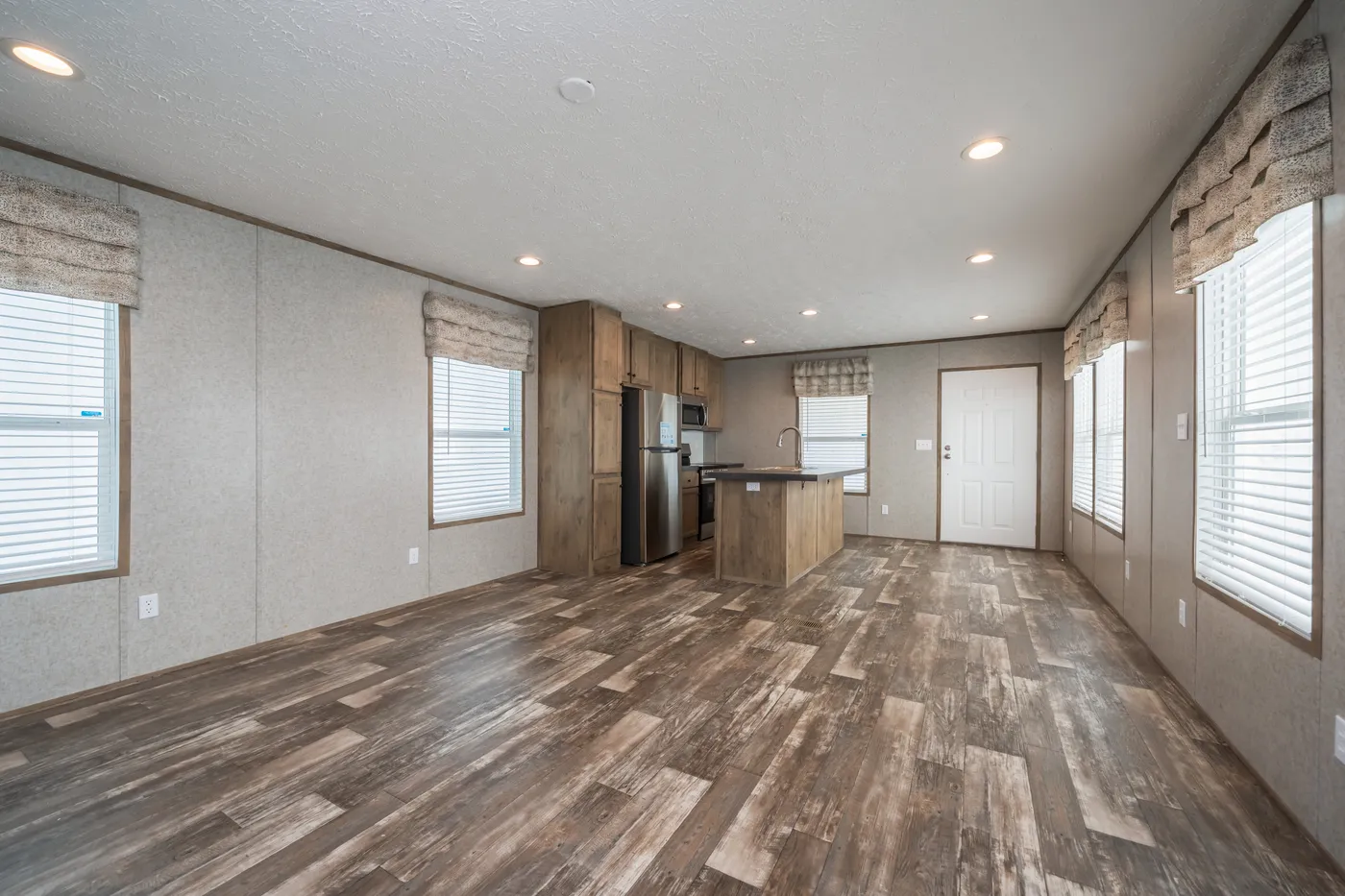The LAKESIDE COTTAGE Living Room. This Manufactured Mobile Home features 1 bedroom and 1 bath.