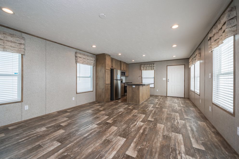 The LAKESIDE COTTAGE Living Room. This Manufactured Mobile Home features 1 bedroom and 1 bath.