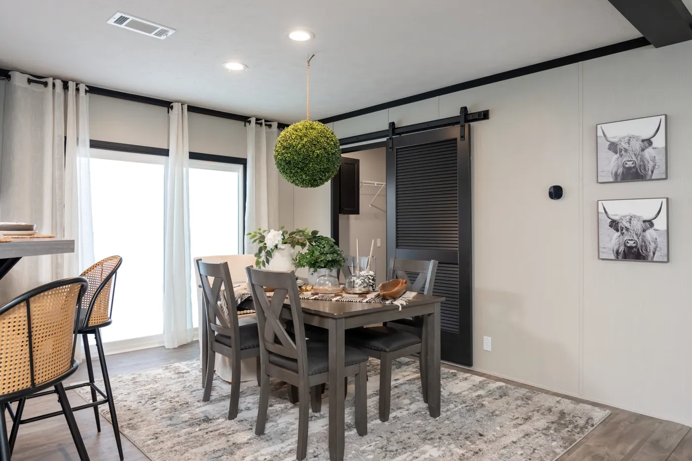 The CRAZY EIGHTS Dining Area. This Manufactured Mobile Home features 4 bedrooms and 2 baths.