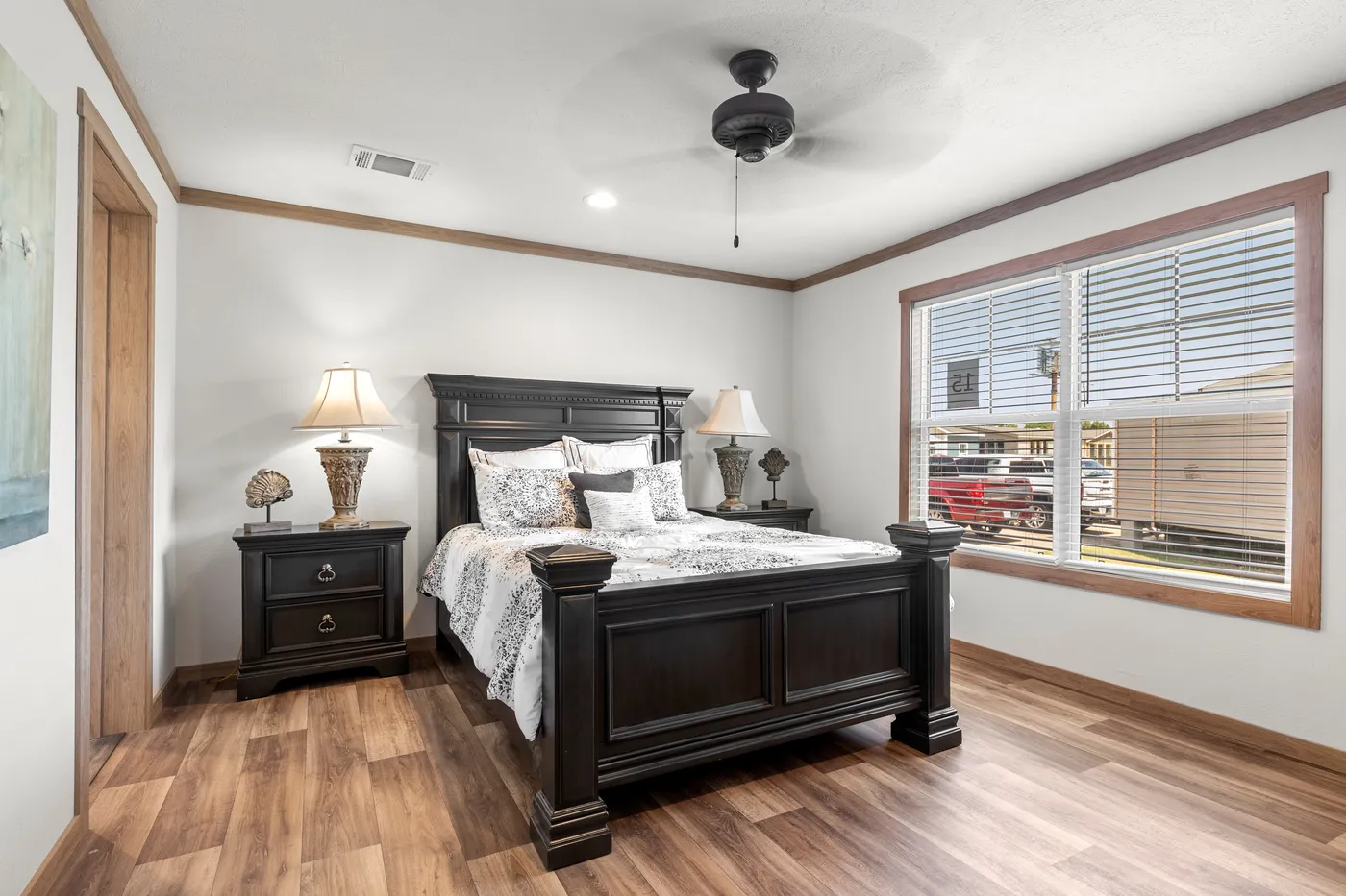 The LIZZIE Primary Bedroom. This Manufactured Mobile Home features 3 bedrooms and 2 baths.