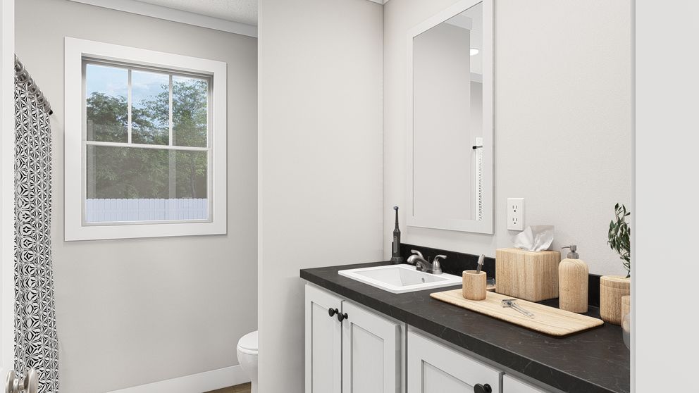 The BROWN EYED GIRL Guest Bedroom. This Manufactured Mobile Home features 4 bedrooms and 2 baths.
