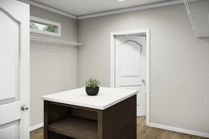 The HUXTON II Primary Bedroom. This Manufactured Mobile Home features 4 bedrooms and 2 baths.