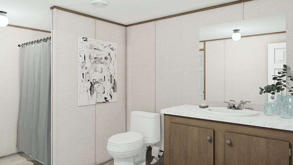 The TRIUMPH Primary Bathroom. This Manufactured Mobile Home features 5 bedrooms and 3 baths.