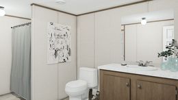The TRIUMPH Primary Bathroom. This Manufactured Mobile Home features 5 bedrooms and 3 baths.