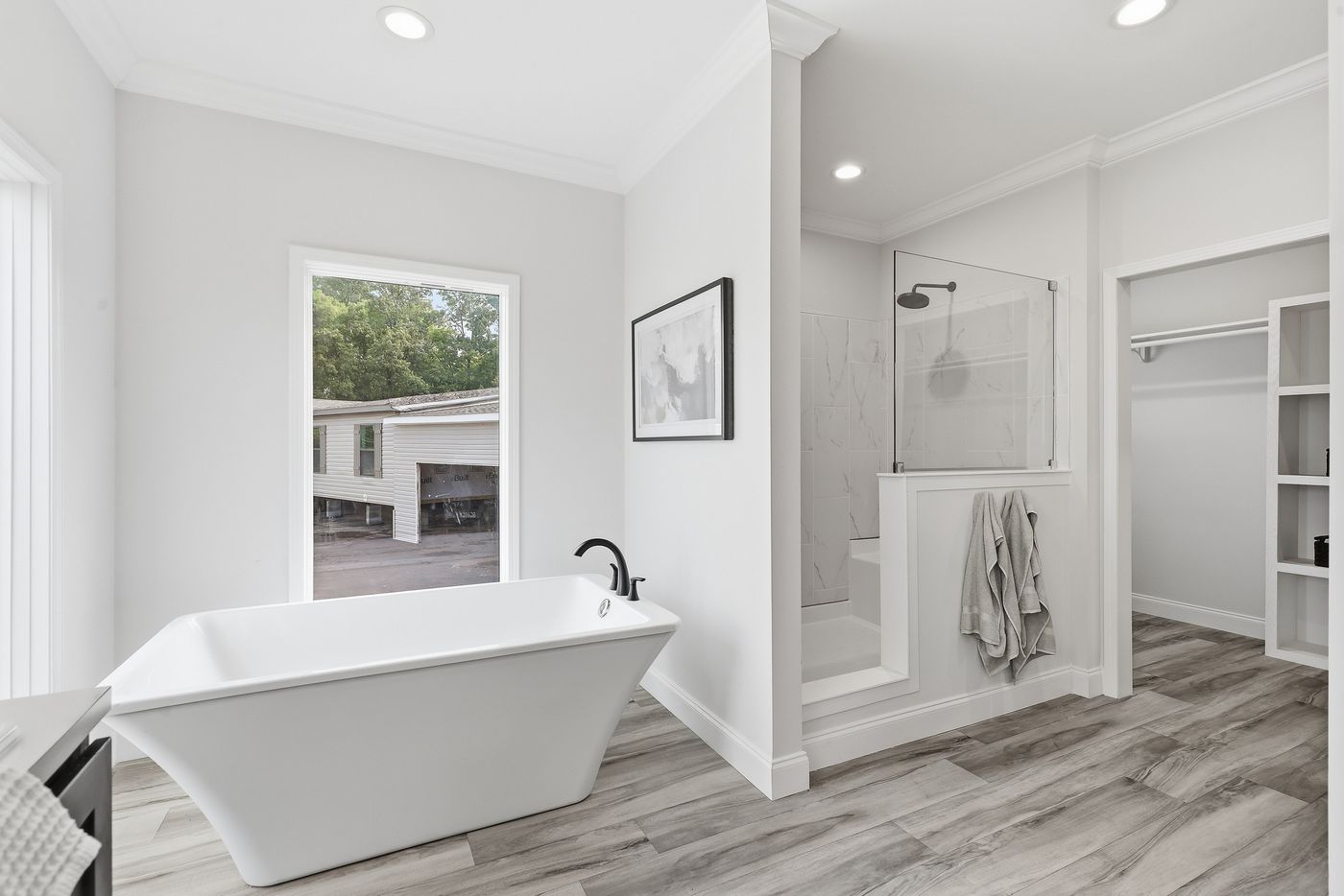 The THE SUMMIT Primary Bathroom. This Manufactured Mobile Home features 3 bedrooms and 2 baths.