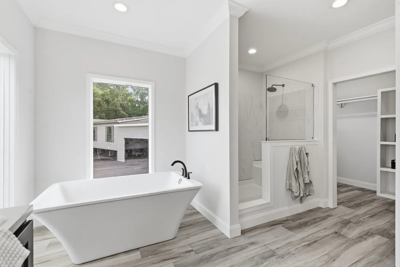 The THE SUMMIT Primary Bathroom. This Manufactured Mobile Home features 3 bedrooms and 2 baths.
