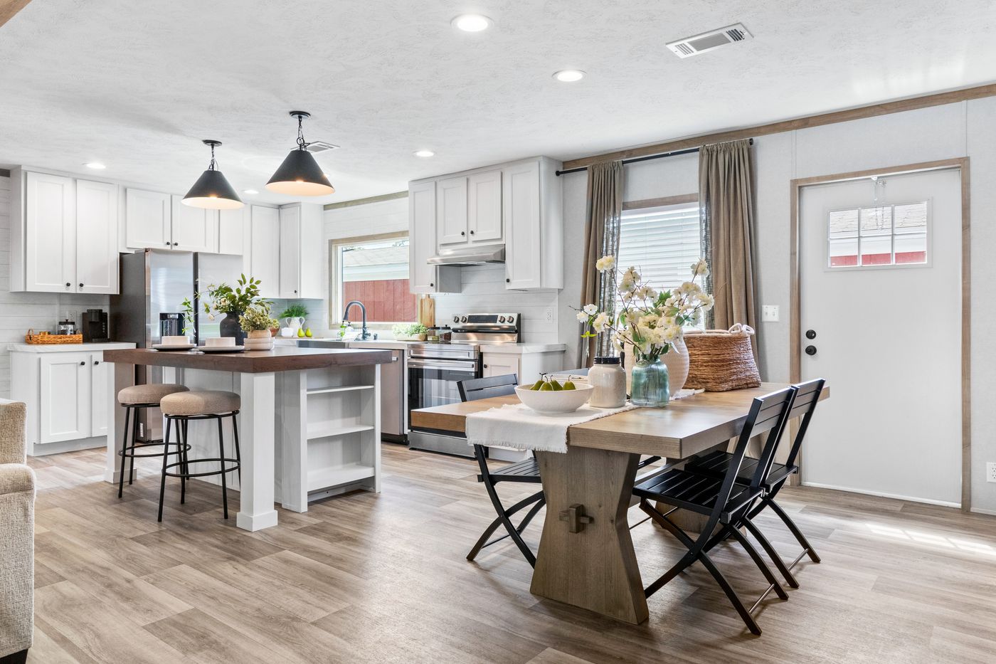 The THE REAL DEAL Dining Area. This Manufactured Mobile Home features 3 bedrooms and 2 baths.