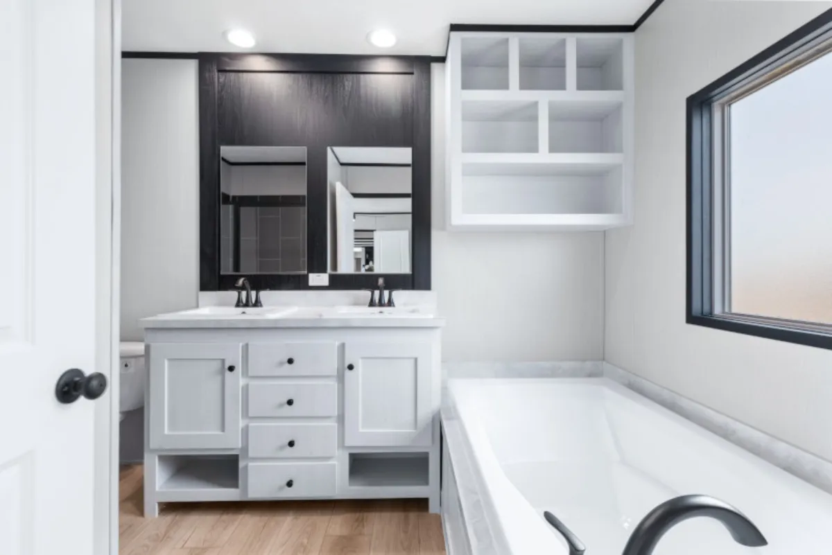 The ANNIVERSARY 16763S Primary Bathroom. This Manufactured Mobile Home features 3 bedrooms and 2 baths.