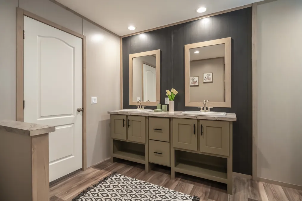 The RAINIER Primary Bathroom. This Manufactured Mobile Home features 4 bedrooms and 3 baths.