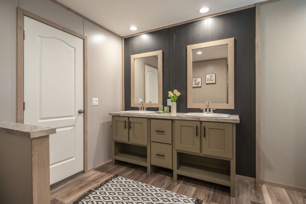 The RAINIER Primary Bathroom. This Manufactured Mobile Home features 4 bedrooms and 3 baths.