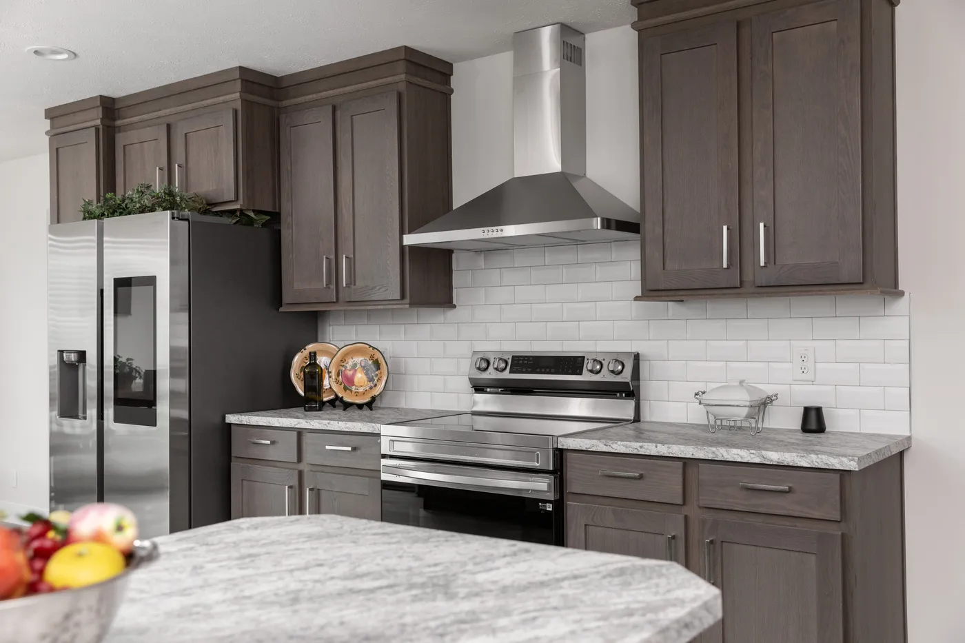 The HILL ST/5628-MS020-1 SECT Kitchen. This Manufactured Mobile Home features 3 bedrooms and 2 baths.