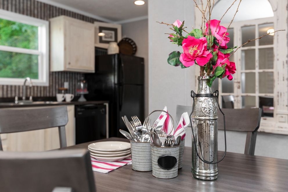 The SAPPHIRE Dining Room. This Manufactured Mobile Home features 3 bedrooms and 2 baths.