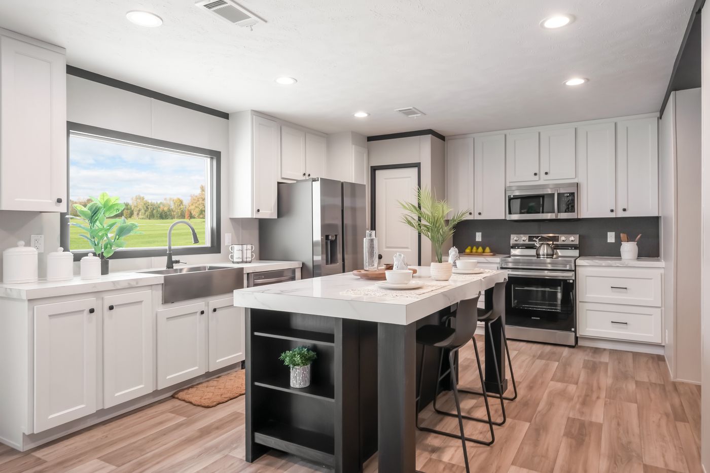 The THE ANNIVERSARY 2.1 Kitchen. This Manufactured Mobile Home features 3 bedrooms and 2 baths.
