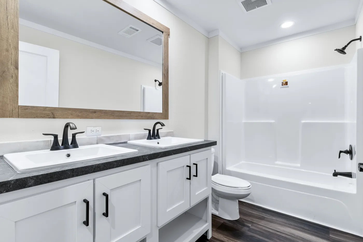The SAWYER ELITE Guest Bathroom. This Manufactured Mobile Home features 3 bedrooms and 2 baths.
