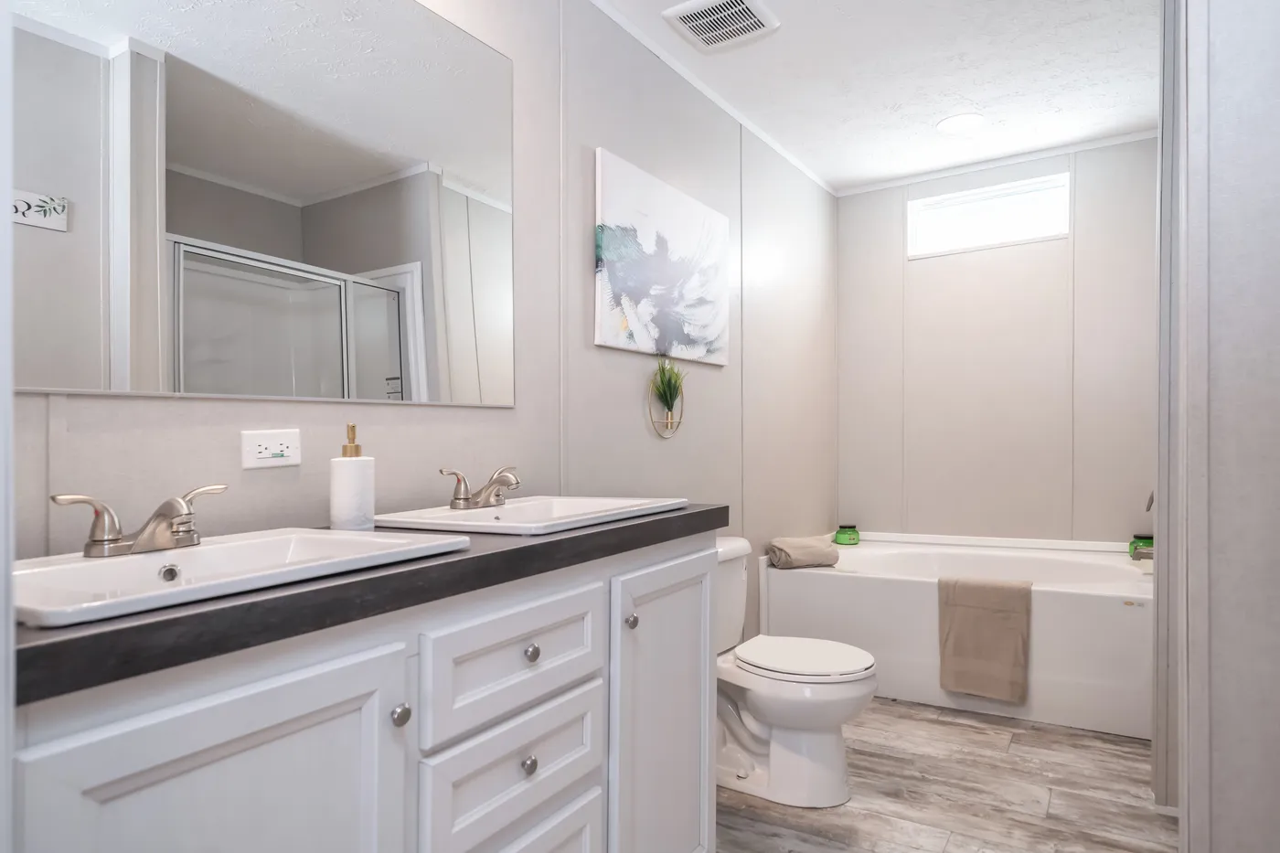 The BENJAMIN Primary Bathroom. This Manufactured Mobile Home features 3 bedrooms and 2 baths.
