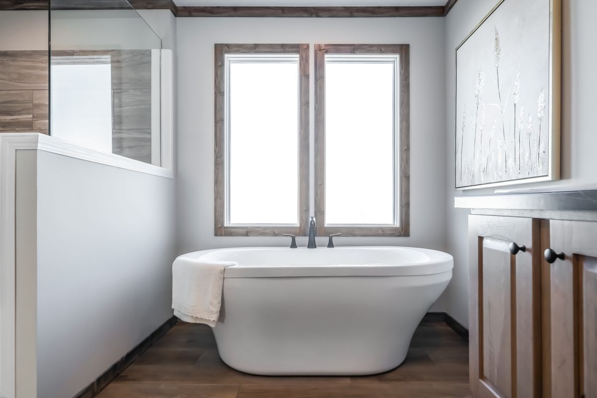 The THE JACKSON Primary Bathroom. This Manufactured Mobile Home features 4 bedrooms and 2 baths.