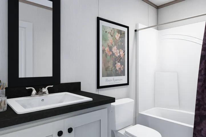 The 5228-E774P THE PULSE Guest Bathroom. This Manufactured Mobile Home features 3 bedrooms and 2 baths.