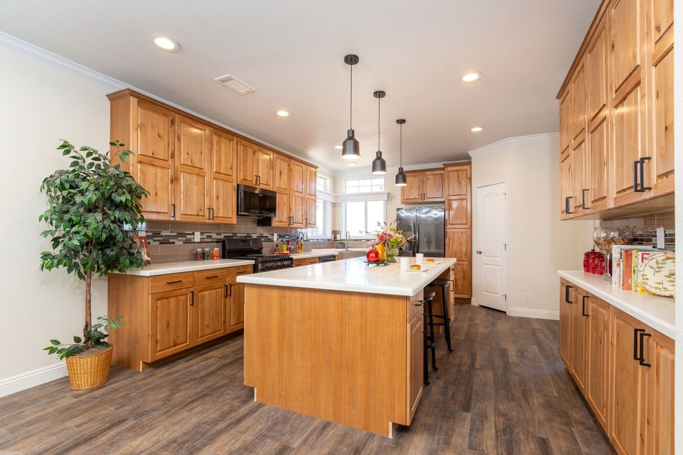 The SUM3076A Kitchen. This Manufactured Mobile Home features 4 bedrooms and 2.5 baths.