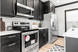 The THE MAUI Kitchen. This Manufactured Mobile Home features 3 bedrooms and 2 baths.