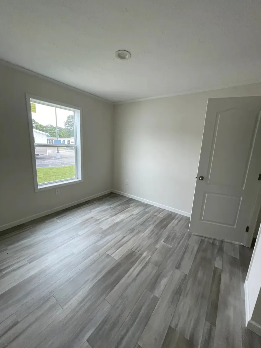 The MOONSTONE Guest Bedroom. This Manufactured Mobile Home features 3 bedrooms and 2 baths.