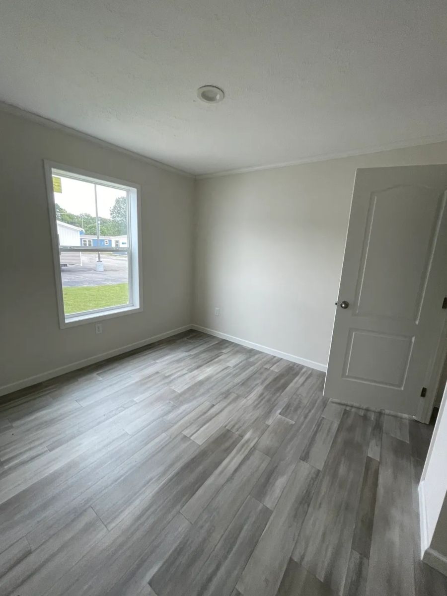 The MOONSTONE Guest Bedroom. This Manufactured Mobile Home features 3 bedrooms and 2 baths.