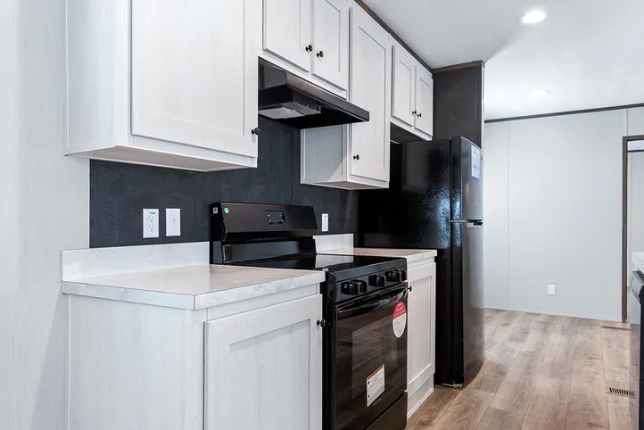 The SELECT 16723B Kitchen. This Manufactured Mobile Home features 3 bedrooms and 2 baths.