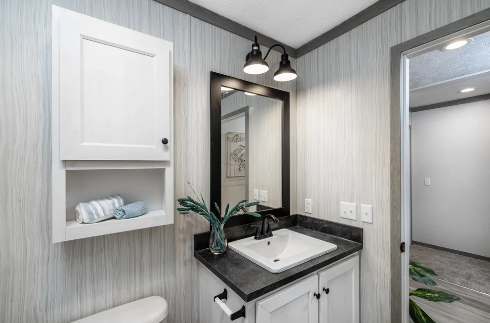 The 6428-E792 THE PULSE Guest Bathroom. This Manufactured Mobile Home features 3 bedrooms and 2.5 baths.