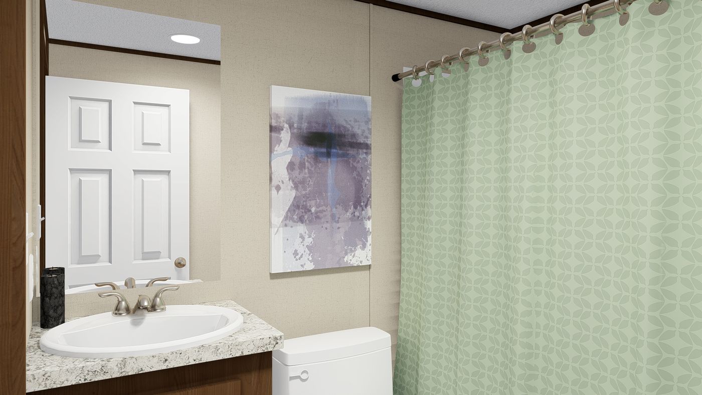 The GLORY Guest Bathroom. This Manufactured Mobile Home features 3 bedrooms and 2 baths.