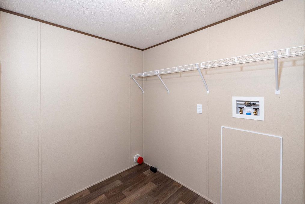 The PRIDE Utility Room. This Manufactured Mobile Home features 4 bedrooms and 2 baths.