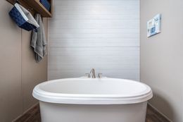 The FARMHOUSE BREEZE 72 Primary Bathroom. This Manufactured Mobile Home features 4 bedrooms and 2 baths.