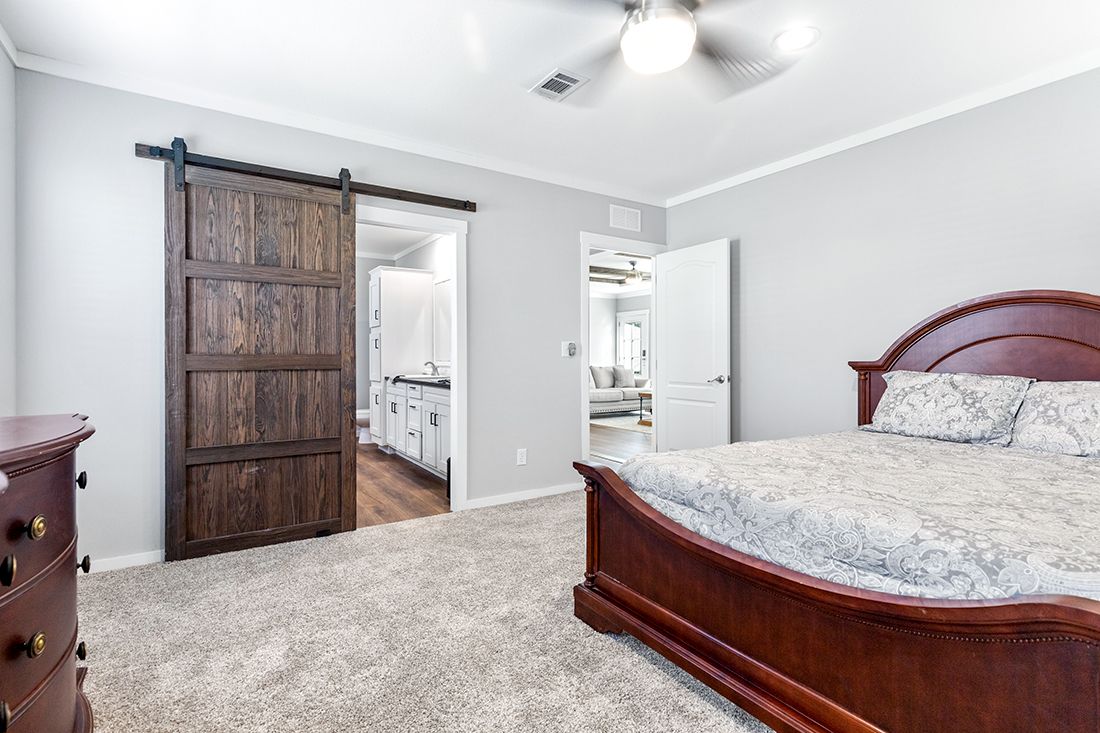 The THE VAIL Primary Bedroom. This Manufactured Mobile Home features 3 bedrooms and 2 baths.