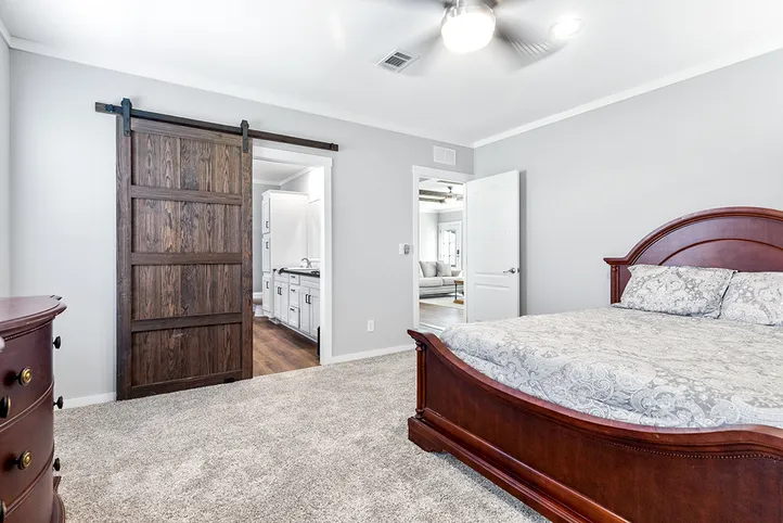 The THE VAIL Primary Bedroom. This Manufactured Mobile Home features 3 bedrooms and 2 baths.