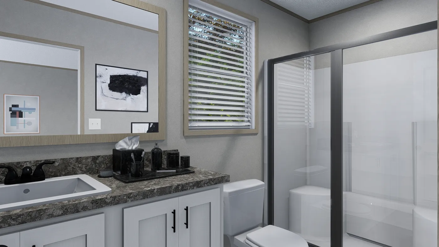 The PHOENIX Primary Bathroom. This Manufactured Mobile Home features 2 bedrooms and 2 baths.