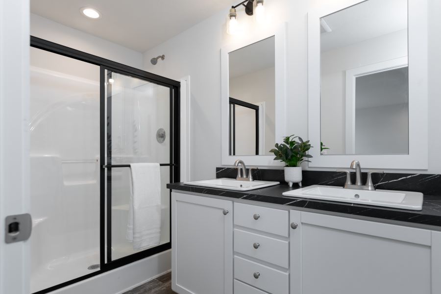 The DAYBREAK/4828-MS059 SECT Primary Bathroom. This Manufactured Mobile Home features 3 bedrooms and 2 baths.