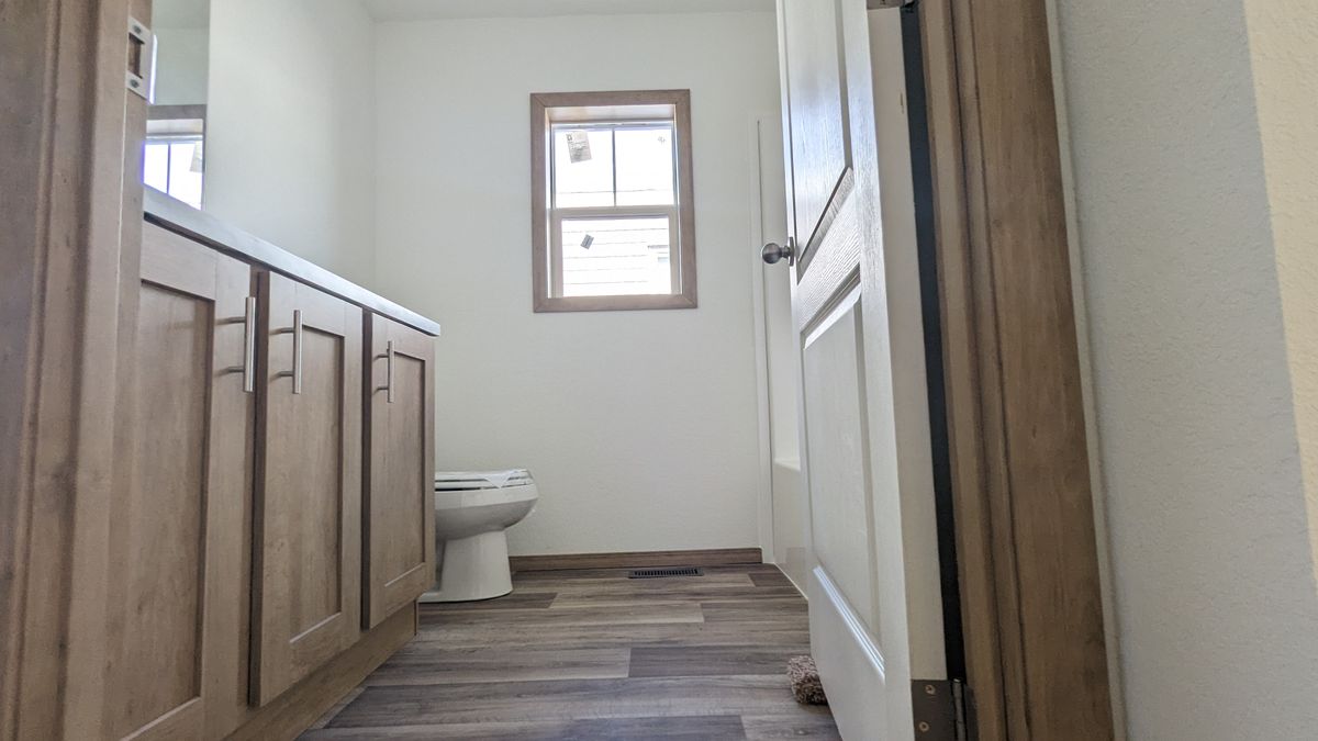 The LIFESTYLE 215 Primary Bathroom. This Manufactured Mobile Home features 1 bedroom and 1 bath.