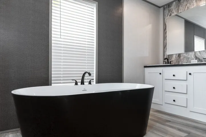 The PLATINUM ANNIVERSARY Primary Bathroom. This Manufactured Mobile Home features 3 bedrooms and 2 baths.