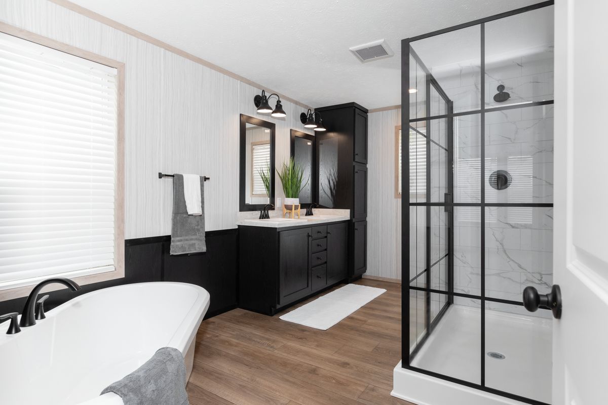 The 6032-5700 THE PULSE Primary Bathroom. This Manufactured Mobile Home features 3 bedrooms and 2 baths.