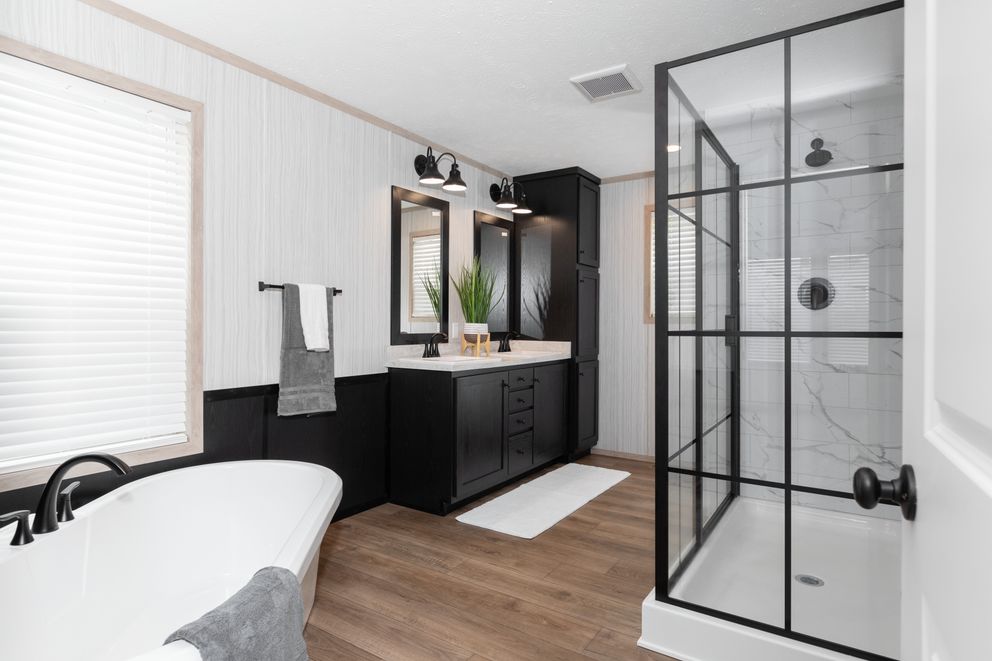 The 6032-5700 THE PULSE Primary Bathroom. This Manufactured Mobile Home features 3 bedrooms and 2 baths.