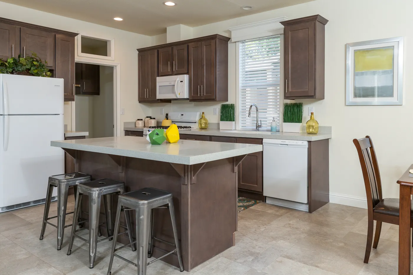 The FAIRPOINT 27543F Kitchen. This Manufactured Mobile Home features 3 bedrooms and 2 baths.