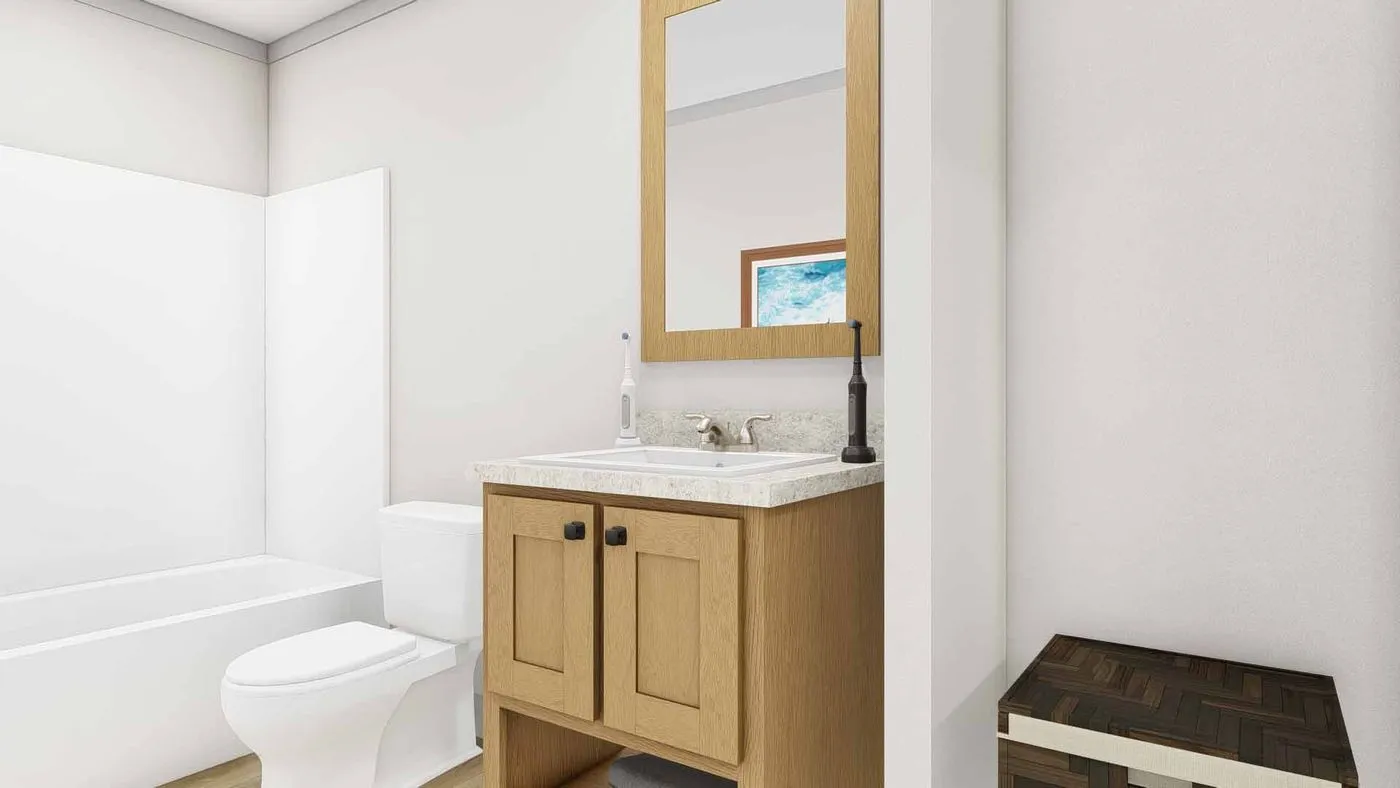 The THREE LITTLE BIRDS Guest Bathroom. This Manufactured Mobile Home features 3 bedrooms and 2 baths.