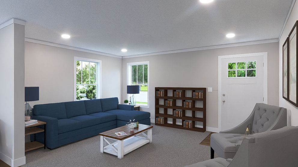 The UNDER PRESSURE Living Room. This Manufactured Mobile Home features 3 bedrooms and 2 baths.