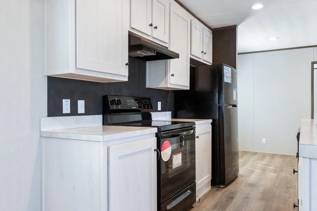 The SELECT 16722S Kitchen. This Manufactured Mobile Home features 2 bedrooms and 2 baths.