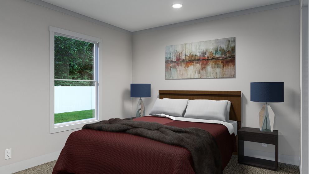 The SWEET DREAMS Primary Bedroom. This Manufactured Mobile Home features 3 bedrooms and 2 baths.
