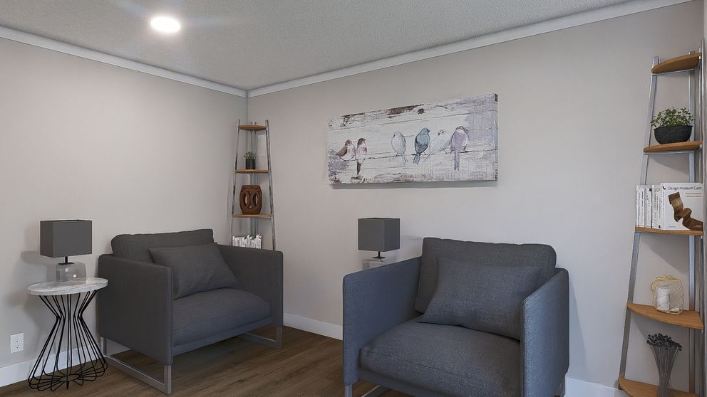 The ROCKET MAN Living Room. This Manufactured Mobile Home features 3 bedrooms and 2 baths.